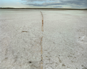 Martin Stupich Iron Pipe Merging with Alkali Lake Bed (South of Baroil, Sweetwater County, WY) 2006, Pigment Inkjet on Acid Free Fine Art Photo Paper, 25x32 inches © Martin Stupich, Currently on display in Environmental Impact