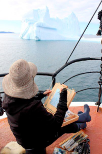 Lisa Lebofsky painting from a boat off Greenland's coast.