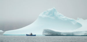Getting personal: Cory paint an iceberg “plein air” for a folding canoe. Baffin Island, Nunavut, Canada.