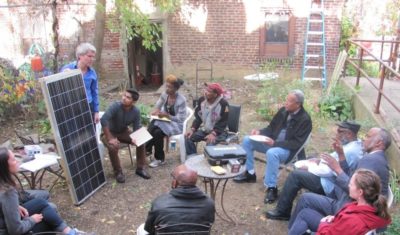 Swarthmore professor Carr Everbach leads a workshop with North Philadelphia community members about solar panels and solar energy at Serenity House, a community center in North Philadelphia, 2014. Image courtesy of Serenity Soular.